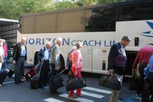 Travelers boarding bus