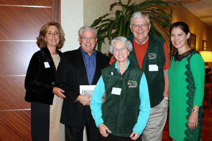 Cruise Specialists guests in the Vest they received on a South Pacific Cruise after the send off gala with Cruise Specialist President and Holland America President and Vice President.