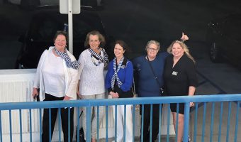 women smiling at cruise pier